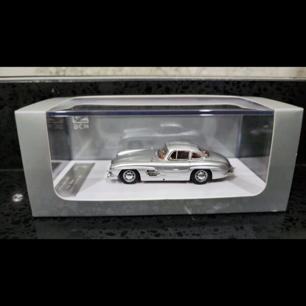 DCM MERCEDES-BENZ 300 SL GULLWING W198 SILVER + BROWN INTERIOR
